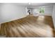 Spacious open-concept living area connecting to a modern kitchen with natural light at 355 New Marietta Hwy, Roswell, GA 30075