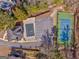 Aerial view of community amenities including a pool, parking area, and tennis courts, nestled amongst trees at 4213 Bretdale Nw Run, Kennesaw, GA 30152