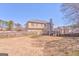 Large backyard, fenced in, with a wooden deck and a two-story house at 4213 Bretdale Nw Run, Kennesaw, GA 30152
