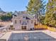Back of home with an in-ground pool with a pool cover, iron fence, and small balcony on the second level at 4213 Bretdale Nw Run, Kennesaw, GA 30152