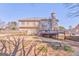 Spacious backyard featuring a wooden fence, large deck, and a view of the home's exterior at 4213 Bretdale Nw Run, Kennesaw, GA 30152
