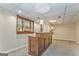 Basement featuring a custom wooden bar with shelving and mirror, ideal for entertaining at 4213 Bretdale Nw Run, Kennesaw, GA 30152