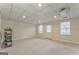 Spacious carpeted basement area with projector and ample room for entertainment at 4213 Bretdale Nw Run, Kennesaw, GA 30152