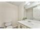 Bathroom featuring a toilet, vanity, and sink with decorative plants at 4213 Bretdale Nw Run, Kennesaw, GA 30152