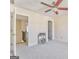 Carpeted bedroom with a ceiling fan and easy access to additional rooms and a staircase at 4213 Bretdale Nw Run, Kennesaw, GA 30152