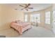 Bedroom featuring a ceiling fan, carpet, natural light, and neutral color scheme at 4213 Bretdale Nw Run, Kennesaw, GA 30152