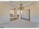 This dining room has neutral paint, a hanging light and views into other rooms at 4213 Bretdale Nw Run, Kennesaw, GA 30152