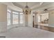 The dining room has a hanging light, lots of light from bay window and open doorway at 4213 Bretdale Nw Run, Kennesaw, GA 30152