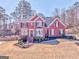Charming two-story brick home with manicured lawn and a well-maintained landscape at 4213 Bretdale Nw Run, Kennesaw, GA 30152
