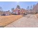 Traditional two-story brick home with a manicured lawn and driveway at 4213 Bretdale Nw Run, Kennesaw, GA 30152