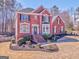 Attractive two-story brick home featuring manicured landscaping and a welcoming front facade at 4213 Bretdale Nw Run, Kennesaw, GA 30152