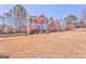 Classic brick home with manicured front yard and long driveway at 4213 Bretdale Nw Run, Kennesaw, GA 30152