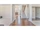 Inviting foyer featuring hardwood floors, a staircase, and an open layout with modern finishes at 4213 Bretdale Nw Run, Kennesaw, GA 30152