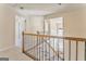 Upstairs hallway with wooden railings and hardwood stairs at 4213 Bretdale Nw Run, Kennesaw, GA 30152