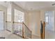Upper hallway with wooden railing overlooking the living room at 4213 Bretdale Nw Run, Kennesaw, GA 30152