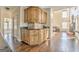 Kitchen features dark hardwood floors, wooden cabinets, tile backsplash, and dark countertop at 4213 Bretdale Nw Run, Kennesaw, GA 30152