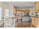 Eat-in kitchen with wood cabinets, granite counters, stainless appliances, and hardwood floors at 4213 Bretdale Nw Run, Kennesaw, GA 30152