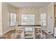 Dining area with hardwood floors and natural light from the large windows at 4213 Bretdale Nw Run, Kennesaw, GA 30152