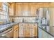 Kitchen with wood cabinets, granite counters, stainless appliances, and a sink at 4213 Bretdale Nw Run, Kennesaw, GA 30152