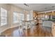 Eat-in kitchen with wood cabinets, granite counters, stainless appliances, and hardwood floors at 4213 Bretdale Nw Run, Kennesaw, GA 30152