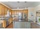 Spacious kitchen featuring stainless steel appliances, a central island, and wooden cabinetry at 4213 Bretdale Nw Run, Kennesaw, GA 30152