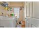 Practical laundry room with a washer, a dryer, and a storage area at 4213 Bretdale Nw Run, Kennesaw, GA 30152