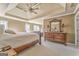 Spacious main bedroom features tray ceilings, a ceiling fan, and a large, decorative dresser with mirror at 4213 Bretdale Nw Run, Kennesaw, GA 30152