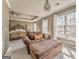 A spacious main bedroom with a sitting area, featuring natural light, neutral colors, and carpet at 4213 Bretdale Nw Run, Kennesaw, GA 30152