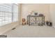 Well-lit office space has a charming chair, ornate desk, and large windows at 4213 Bretdale Nw Run, Kennesaw, GA 30152