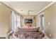 Cozy sitting room featuring neutral colors, a decorative chandelier, and a comfortable brown armchair at 4213 Bretdale Nw Run, Kennesaw, GA 30152