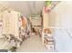 Spacious walk-in closet with custom shelving and ample storage space for clothing and accessories at 4213 Bretdale Nw Run, Kennesaw, GA 30152