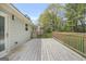 Spacious wooden back deck perfect for entertaining or relaxing outdoors with a view of the backyard at 474 Autumn Dr, Riverdale, GA 30274