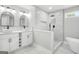 Spa-like bathroom features double sink vanity, soaking tub, and tiled walk-in shower at 474 Autumn Dr, Riverdale, GA 30274