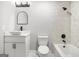 Modern bathroom with white vanity, vessel sink, black fixtures, and tiled shower at 474 Autumn Dr, Riverdale, GA 30274