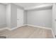 An airy bedroom with neutral tones, a clean door, and sleek baseboards for a modern appeal at 474 Autumn Dr, Riverdale, GA 30274