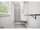 Walk-in closet features a window and built-in shelving at 474 Autumn Dr, Riverdale, GA 30274