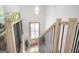 Bright entryway with wood stairs, black metal balusters, and natural wood trim at 474 Autumn Dr, Riverdale, GA 30274