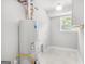 Clean, bright laundry area with a new water heater and updated flooring at 474 Autumn Dr, Riverdale, GA 30274