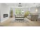 Elegant living room with coffered ceilings, fireplace, stylish decor, and plenty of natural light at 474 Autumn Dr, Riverdale, GA 30274