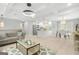Open-concept living space connecting the kitchen and living room with modern design and decor at 474 Autumn Dr, Riverdale, GA 30274