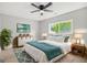 Bedroom with large window, modern decor, ceiling fan, and contemporary furniture at 474 Autumn Dr, Riverdale, GA 30274