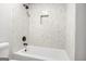 Shower with mosaic tiles, black fixtures, and convenient built-in niche at 474 Autumn Dr, Riverdale, GA 30274