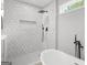 Walk-in shower featuring mosaic tile and rainfall showerhead at 474 Autumn Dr, Riverdale, GA 30274