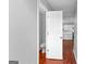 Small bathroom showing a toilet and white door at 4506 White Rd, Douglasville, GA 30135