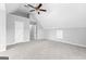 Carpeted attic bedroom features an open door and angled ceilings at 4506 White Rd, Douglasville, GA 30135