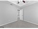 Large bedroom with carpet, tray ceiling, fan and connecting door at 4506 White Rd, Douglasville, GA 30135
