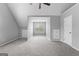 Attic bedroom has neutral carpet, vaulted ceilings, and double windows at 4506 White Rd, Douglasville, GA 30135