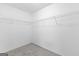 Walk-in closet with carpet and simple wire shelving system at 4506 White Rd, Douglasville, GA 30135