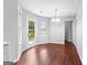 Dining area with hardwood-look floors and natural light from large backyard-facing doors and windows at 4506 White Rd, Douglasville, GA 30135