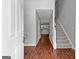 Foyer showcasing wood floors, staircase, and an open view to the kitchen at 4506 White Rd, Douglasville, GA 30135
